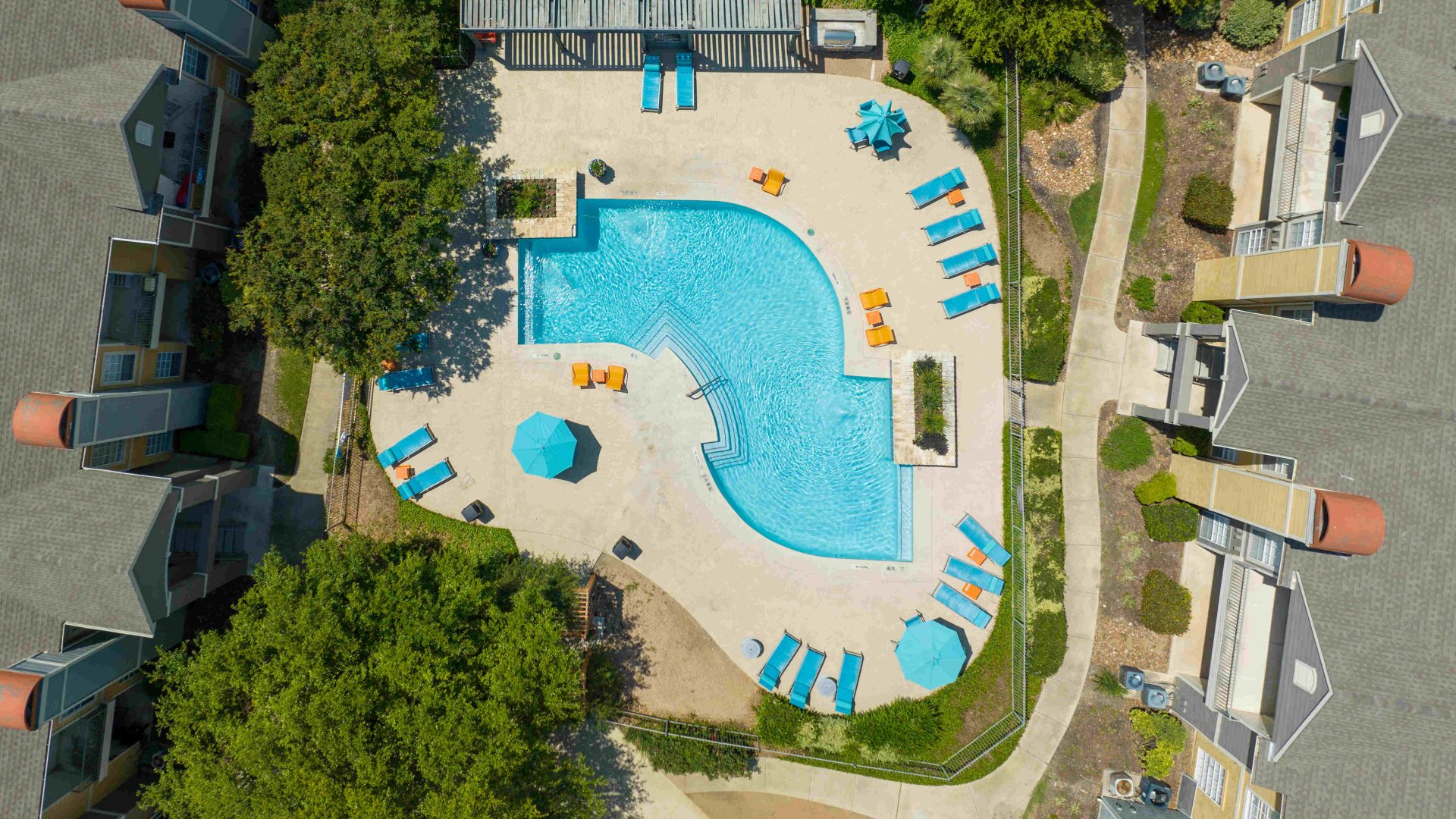 an aerial view of a pool and lawn area at The Westmount at Three Fountains